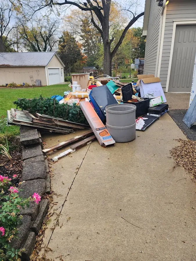 Dumpster being loaded with debris for 10 Yard Dumpster Rental in Brookfield